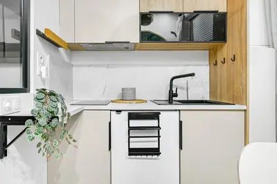 Cuisine ou kitchenette dans l'établissement La Rêverie - Love Room Paris - Jacuzzi Pro