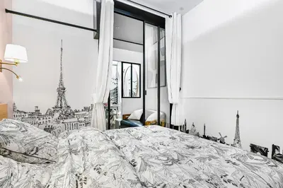 Un ou plusieurs lits dans un hébergement de l'établissement La Rêverie - Love Room Paris - Jacuzzi Pro
