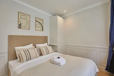 Un ou plusieurs lits dans un hébergement de l'établissement Eiffel Tower Apartment Invalides