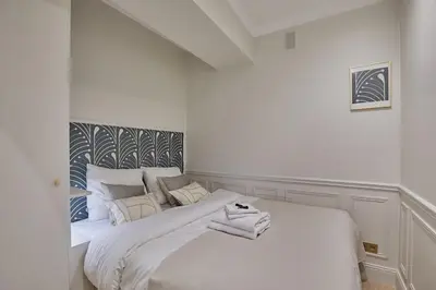 Un ou plusieurs lits dans un hébergement de l'établissement Eiffel Tower Apartment Invalides
