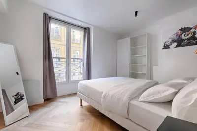 Un ou plusieurs lits dans un hébergement de l'établissement MyKeypers - Stylish & Luxury Duplex 2BR-8P - Le Marais