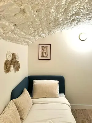 Un ou plusieurs lits dans un hébergement de l'établissement Apartment Saint Germain des Pres Bon Marche by Studio Prestige