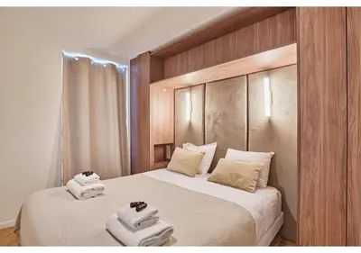 Un ou plusieurs lits dans un hébergement de l'établissement Sublim AC Apartment Opéra Madeleine