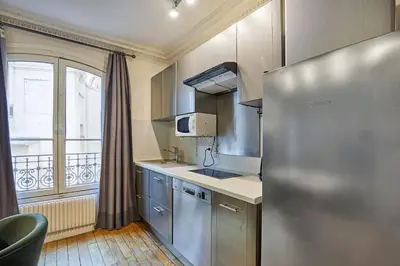 Cuisine ou kitchenette dans l'établissement Charming Apartment Center of Paris by Studio Prestige