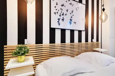 Un ou plusieurs lits dans un hébergement de l'établissement Super appartement 2BR 6P Bastille