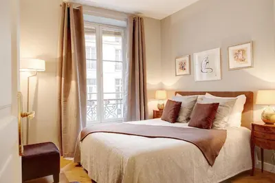 Un ou plusieurs lits dans un hébergement de l'établissement Blanc Manteau Residence