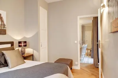 Un ou plusieurs lits dans un hébergement de l'établissement Blanc Manteau Residence