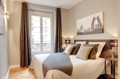Un ou plusieurs lits dans un hébergement de l'établissement Blanc Manteau Residence