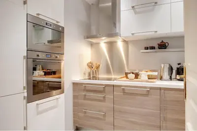 Cuisine ou kitchenette dans l'établissement Blanc Manteau Residence