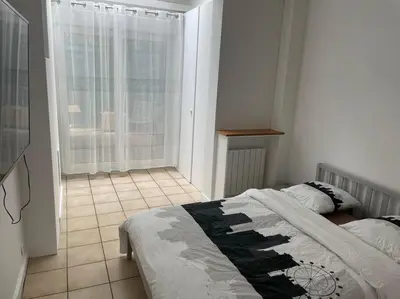 Un ou plusieurs lits dans un hébergement de l'établissement Magnifique appartement