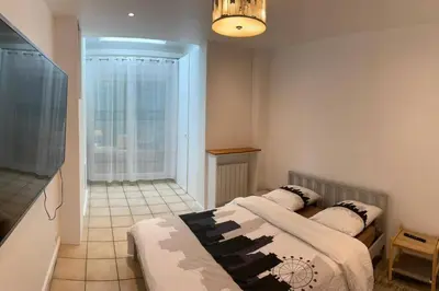Un ou plusieurs lits dans un hébergement de l'établissement Magnifique appartement