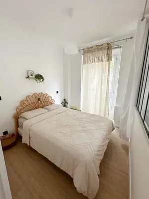 Un ou plusieurs lits dans un hébergement de l'établissement Appartement Calme et Cozy en plein Paris