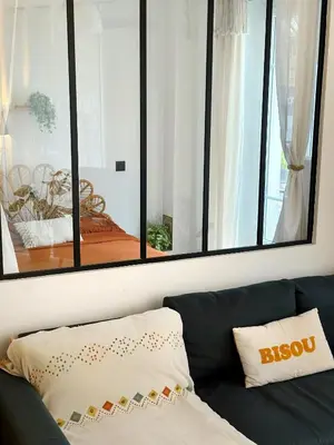 Un ou plusieurs lits dans un hébergement de l'établissement Appartement Calme et Cozy en plein Paris