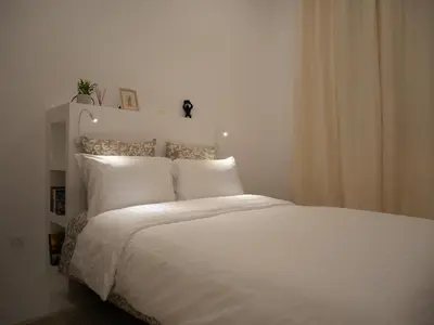 Un ou plusieurs lits dans un hébergement de l'établissement Appart cosy Paris Bercy