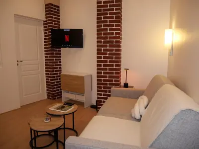 Télévision ou salle de divertissement dans l'établissement Appart cosy Paris Bercy