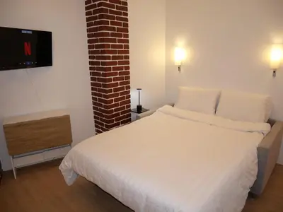 Un ou plusieurs lits dans un hébergement de l'établissement Appart cosy Paris Bercy
