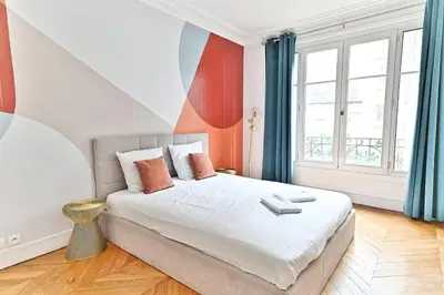 Un ou plusieurs lits dans un hébergement de l'établissement Appartement Haussmannien lumineux et central- II