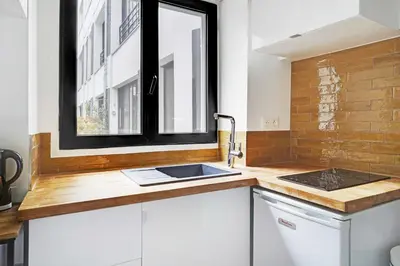 Cuisine ou kitchenette dans l'établissement Classy studio - Marais Bastille
