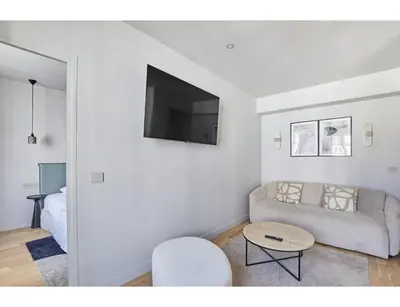 Télévision ou salle de divertissement dans l'établissement Residence apartment Bastille - Le Marais