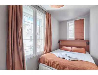 Un ou plusieurs lits dans un hébergement de l'établissement Residence apartment Bastille - Le Marais