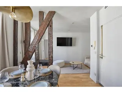 Télévision ou salle de divertissement dans l'établissement Residence apartment Bastille - Le Marais