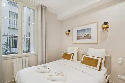 Un ou plusieurs lits dans un hébergement de l'établissement Appartement Elegant 1BDR-2P - Paris Expo