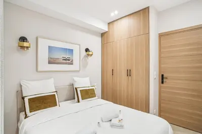 Un ou plusieurs lits dans un hébergement de l'établissement Appartement Elegant 1BDR-2P - Paris Expo