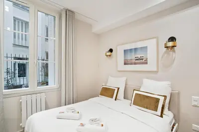 Un ou plusieurs lits dans un hébergement de l'établissement Appartement Elegant 1BDR-2P - Paris Expo