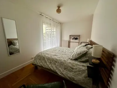 Un ou plusieurs lits dans un hébergement de l'établissement Appartement 5 personnes Léon Frot PARIS