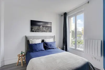 Un ou plusieurs lits dans un hébergement de l'établissement Appartement Suite 12 aux Portes de Paris