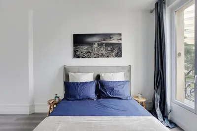 Un ou plusieurs lits dans un hébergement de l'établissement Appartement Suite 12 aux Portes de Paris