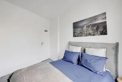 Un ou plusieurs lits dans un hébergement de l'établissement Appartement Suite 12 aux Portes de Paris