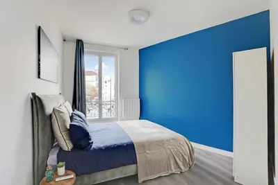 Un ou plusieurs lits dans un hébergement de l'établissement Appartement Suite 12 aux Portes de Paris