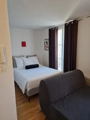 Un ou plusieurs lits dans un hébergement de l'établissement belle appartement au canal de saint martin