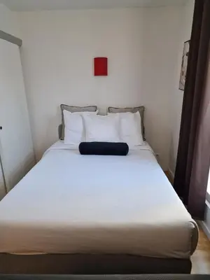 Un ou plusieurs lits dans un hébergement de l'établissement belle appartement au canal de saint martin