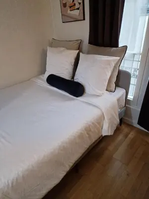 Un ou plusieurs lits dans un hébergement de l'établissement belle appartement au canal de saint martin