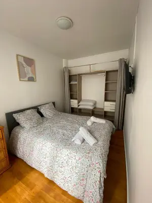 Un ou plusieurs lits dans un hébergement de l'établissement Appartement au cœur de Paris