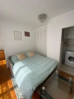 Un ou plusieurs lits dans un hébergement de l'établissement Appartement au cœur de Paris