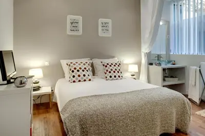 Un ou plusieurs lits dans un hébergement de l'établissement Beauregard central residence