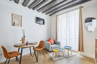 Coin salon dans l'établissement Charming Studio Center of Paris