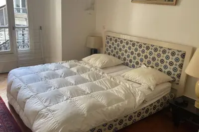 Un ou plusieurs lits dans un hébergement de l'établissement appartement pres de la tour eiffel