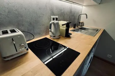 Cuisine ou kitchenette dans l'établissement Studio équipé proche Tour Eiffel