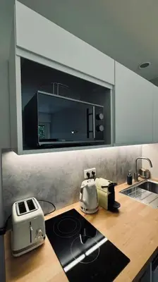 Cuisine ou kitchenette dans l'établissement Studio équipé proche Tour Eiffel