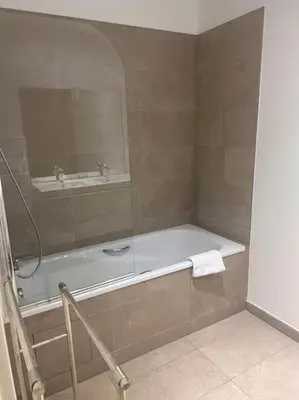 Salle de bains dans l'établissement Appartement Le Rostand