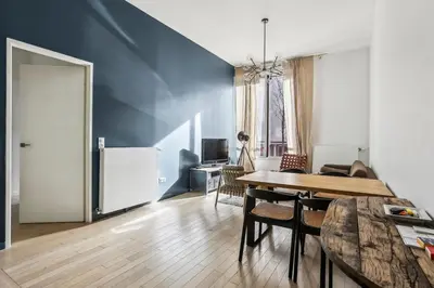 Coin salon dans l'établissement Appartement Le Rostand