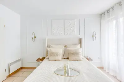 Un ou plusieurs lits dans un hébergement de l'établissement Superbe appartement au Sud de Paris