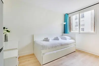 Un ou plusieurs lits dans un hébergement de l'établissement Charming apartment - 2BR-6P - Paris Expo