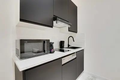 Cuisine ou kitchenette dans l'établissement Cosy modern flat - 1BR- 4P- Oberkampf