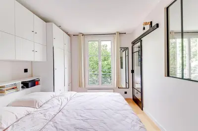Un ou plusieurs lits dans un hébergement de l'établissement Bel appartement 2 pièces place de la République 75011