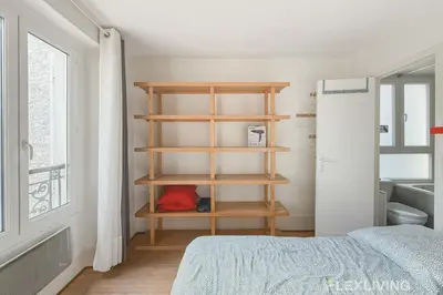 Un ou plusieurs lits dans un hébergement de l'établissement Flexliving - One bedroom - Houdon